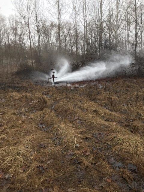 ODNR photo of oil and gas wastewater spraying from the Ohio Power-Gant #17-69 well in Noble County, January 2021.